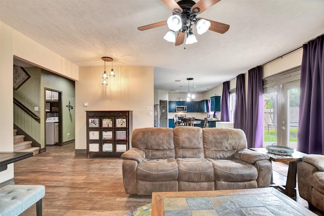 6706 Lindale Manor Ct, Spring, TX 77379 - living room with ceiling fan, stairway, and wood finished floors