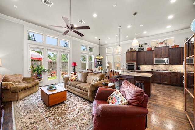 1616 Wrenwood Lks, Houston, TX 77043 - living room with wood finished floors, a ceiling fan, recessed lighting, and crown molding