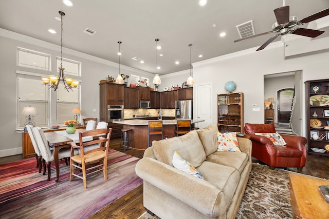 1616 Wrenwood Lks, Houston, TX 77043 - living room featuring ornamental molding, recessed lighting, dark wood-style floors, ceiling fan, and a chandelier