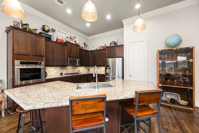 1616 Wrenwood Lks, Houston, TX 77043 - kitchen featuring appliances with stainless steel finishes, a sink, dark wood finished floors, ornamental molding, and backsplash