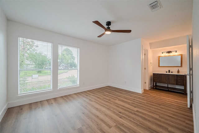 19803 Packwood Dr, Katy, TX 77449 - unfurnished bedroom featuring wood finished floors, connected bathroom, and ceiling fan