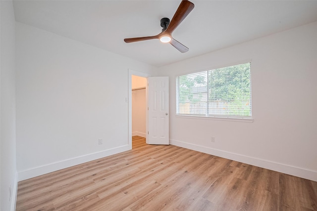 19803 Packwood Dr, Katy, TX 77449 - unfurnished bedroom with light wood finished floors, ceiling fan, a spacious closet, and a closet
