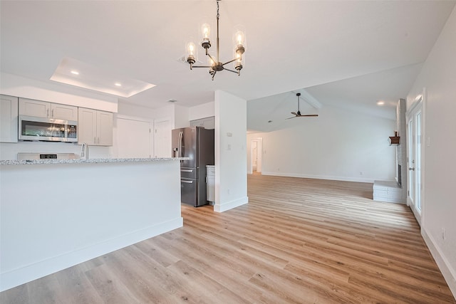 19803 Packwood Dr, Katy, TX 77449 - kitchen featuring appliances with stainless steel finishes, gray cabinetry, a chandelier, light wood finished floors, and recessed lighting