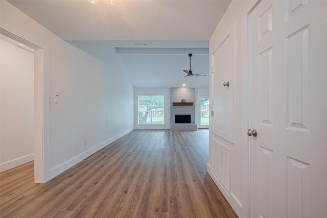 19803 Packwood Dr, Katy, TX 77449 - unfurnished living room featuring a ceiling fan, wood finished floors, and a fireplace