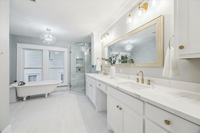 1819 Oxford St, Houston, TX 77008 - bathroom featuring double vanity, a shower stall, a chandelier, and a freestanding tub