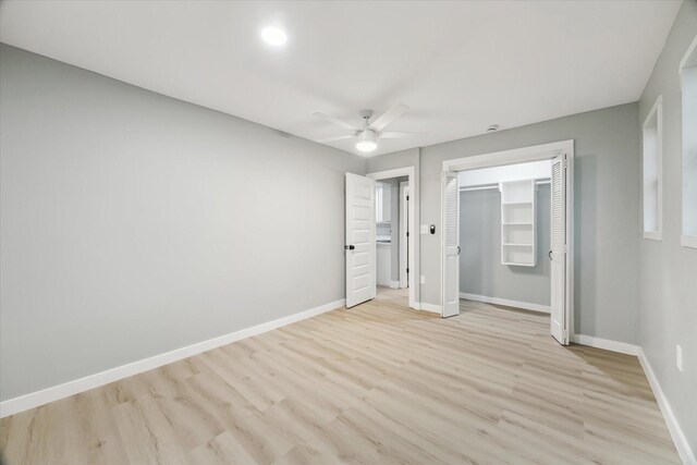 1819 Oxford St, Houston, TX 77008 - unfurnished bedroom featuring light wood-style flooring, ceiling fan, and a closet