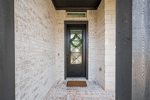 18003 Winding Willow Oak Way, Cypress, TX 77433 - doorway to property featuring brick siding