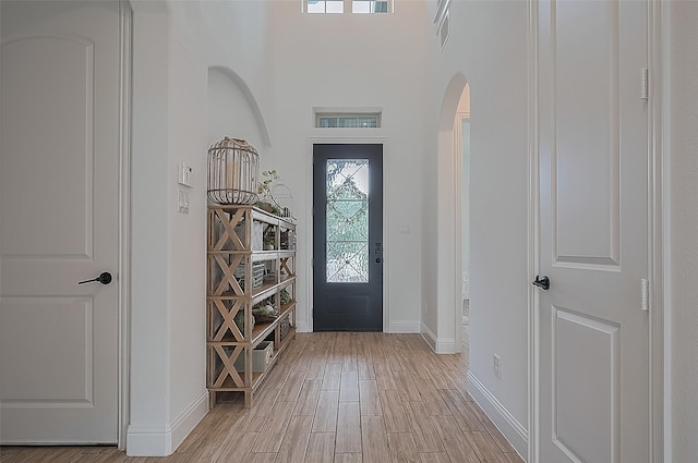 18003 Winding Willow Oak Way, Cypress, TX 77433 - foyer entrance featuring arched walkways and light wood-style floors