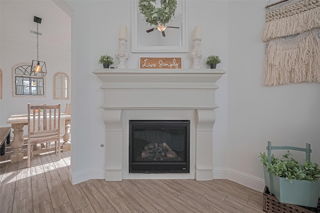 18003 Winding Willow Oak Way, Cypress, TX 77433 - detailed view of a glass covered fireplace and wood finished floors