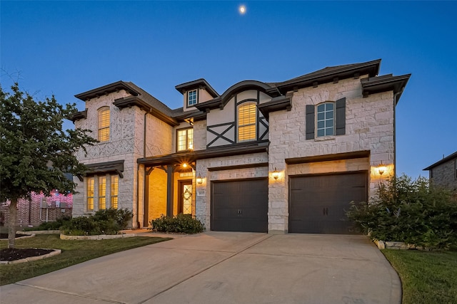 18003 Winding Willow Oak Way, Cypress, TX 77433 - view of front of property with an attached garage, concrete driveway, and stone siding