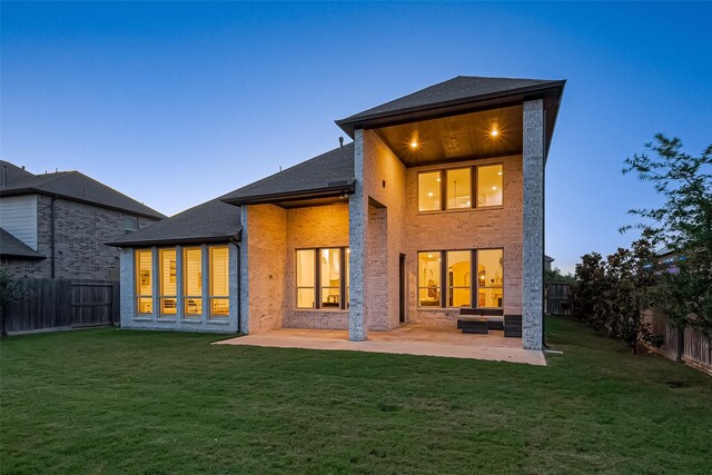 18003 Winding Willow Oak Way, Cypress, TX 77433 - back of house with a patio, brick siding, a fenced backyard, and roof with shingles