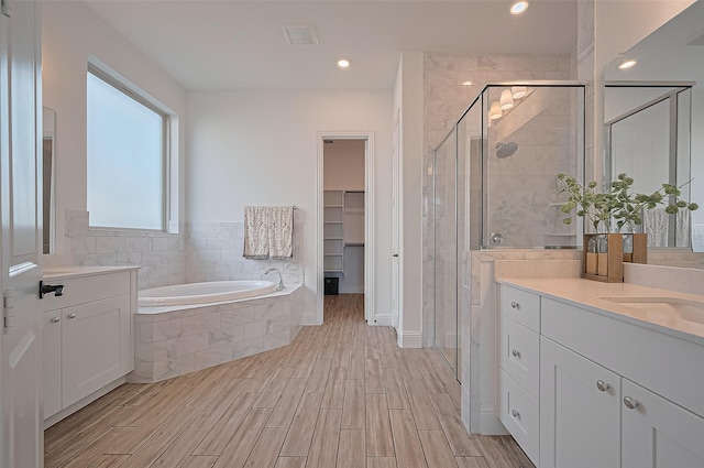 18003 Winding Willow Oak Way, Cypress, TX 77433 - bathroom featuring vanity, a stall shower, a bath, and recessed lighting
