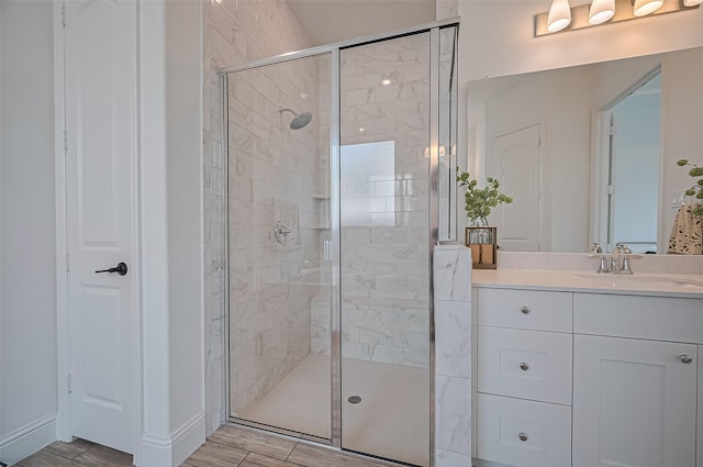 18003 Winding Willow Oak Way, Cypress, TX 77433 - full bathroom with a shower stall, vanity, and wood finished floors