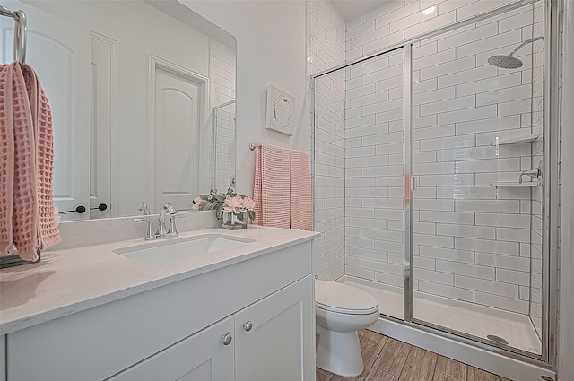 18003 Winding Willow Oak Way, Cypress, TX 77433 - full bathroom with a stall shower, vanity, and wood finished floors