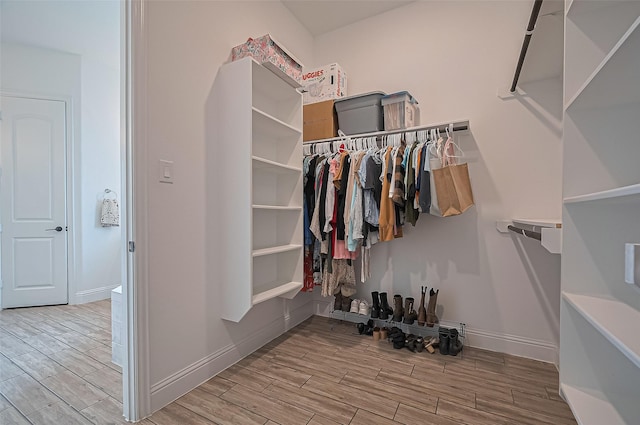 18003 Winding Willow Oak Way, Cypress, TX 77433 - spacious closet featuring wood finished floors