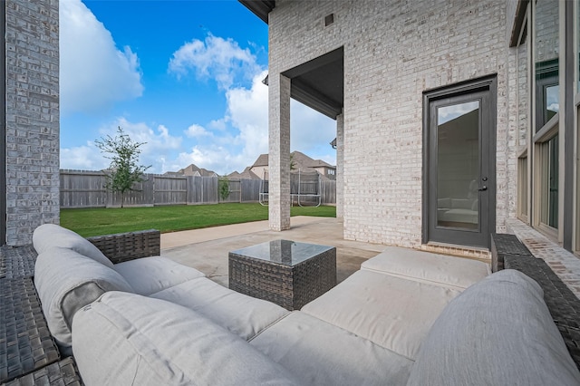 18003 Winding Willow Oak Way, Cypress, TX 77433 - fenced backyard with a patio, an outdoor hangout area, and a trampoline