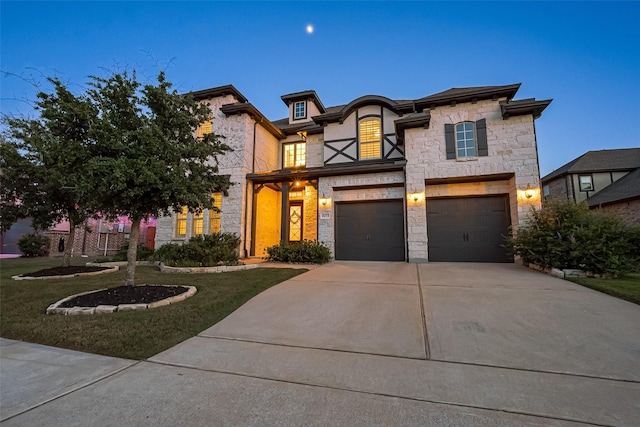 18003 Winding Willow Oak Way, Cypress, TX 77433 - view of front of property featuring stone siding, driveway, an attached garage, and a front yard