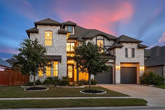 18003 Winding Willow Oak Way, Cypress, TX 77433 - french country inspired facade with stone siding, driveway, an attached garage, and a shingled roof