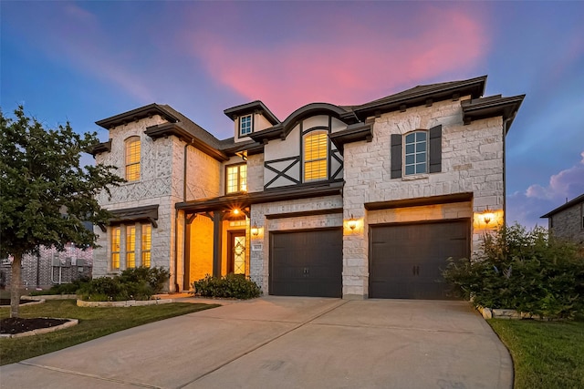 18003 Winding Willow Oak Way, Cypress, TX 77433 - view of front facade featuring a garage, concrete driveway, and stone siding