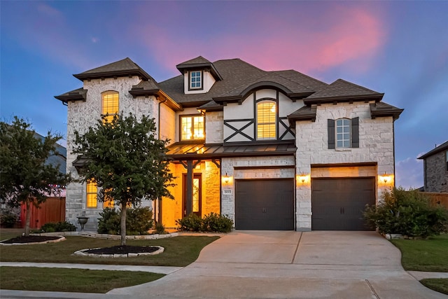 18003 Winding Willow Oak Way, Cypress, TX 77433 - french country style house featuring a garage, concrete driveway, stone siding, and roof with shingles