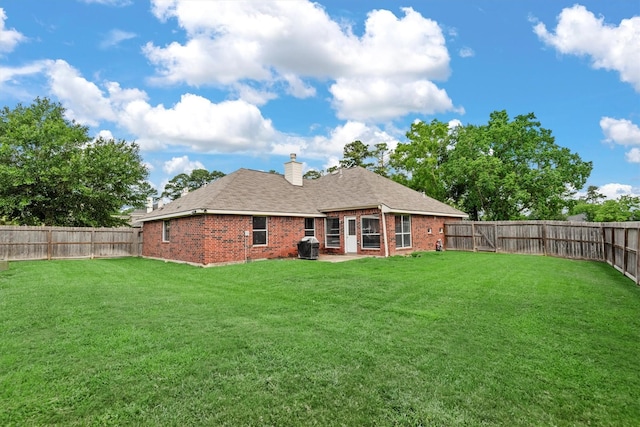 6403 Sagewalk Ct, Spring, TX 77379 - back of property featuring brick siding, a chimney, and a shingled roof