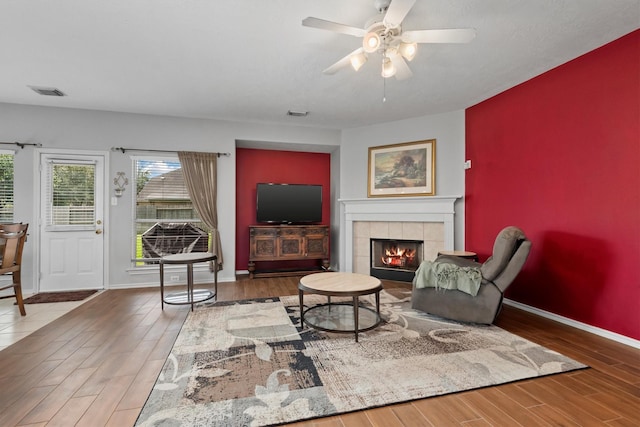 6403 Sagewalk Ct, Spring, TX 77379 - living area with healthy amount of natural light, wood finished floors, baseboards, and ceiling fan