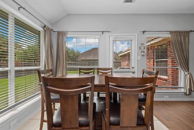 6403 Sagewalk Ct, Spring, TX 77379 - dining area with vaulted ceiling, wood finished floors, and baseboards