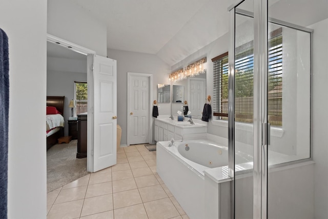 6403 Sagewalk Ct, Spring, TX 77379 - ensuite bathroom featuring tile patterned floors, a whirlpool tub, vanity, and a stall shower