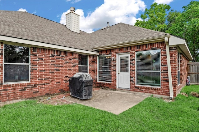 6403 Sagewalk Ct, Spring, TX 77379 - back of property with a patio, brick siding, a shingled roof, and a chimney