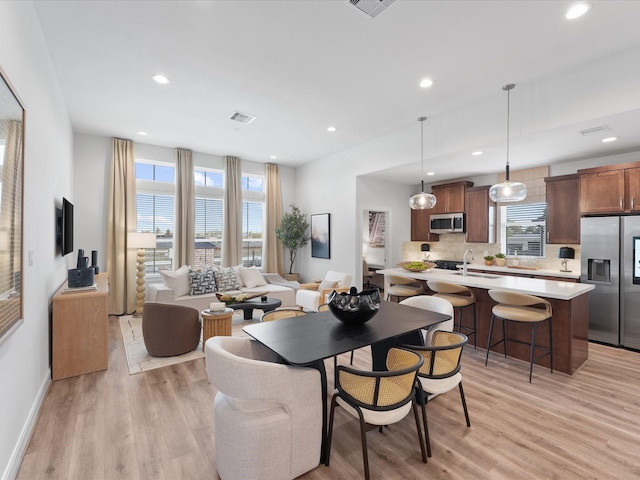 9221 Washington Hts, Houston, TX 77063 - dining area with light wood finished floors, recessed lighting, and baseboards
