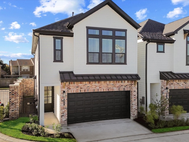 9221 Washington Hts, Houston, TX 77063 - view of front of home with concrete driveway, brick siding, and an attached garage