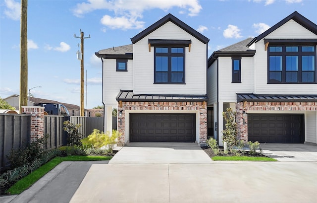 9221 Washington Hts, Houston, TX 77063 - view of front facade with a garage, driveway, and brick siding