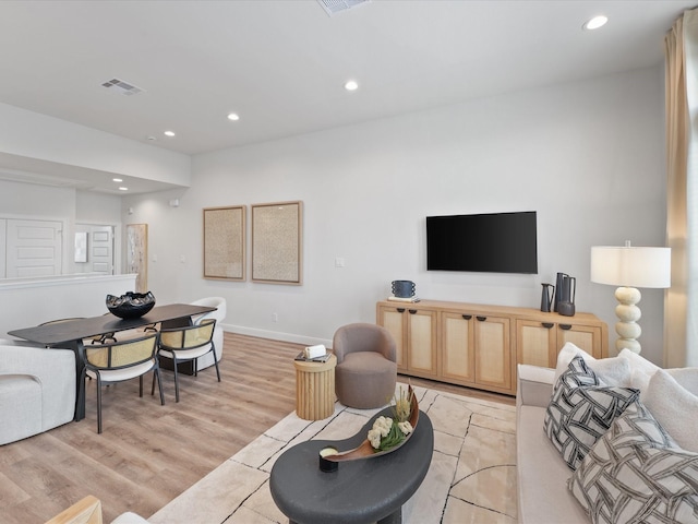 9221 Washington Hts, Houston, TX 77063 - living area featuring recessed lighting, baseboards, and light wood-style floors