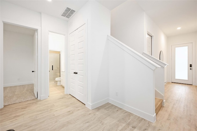 5322 Rue St, Houston, TX 77033 - corridor with light wood-style floors, baseboards, recessed lighting, and stairs