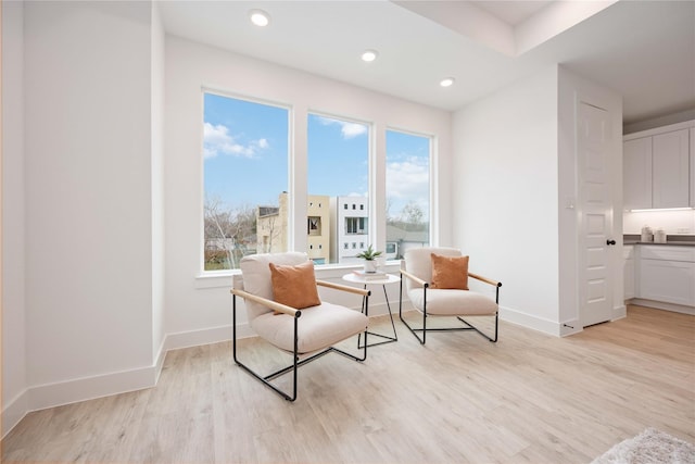 5322 Rue St, Houston, TX 77033 - living area with light wood finished floors, baseboards, and recessed lighting