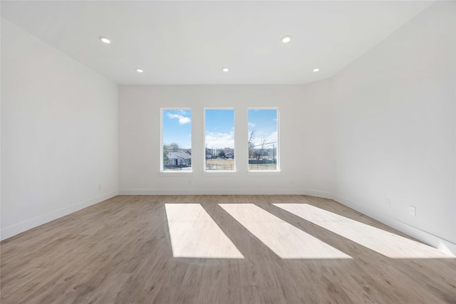 5324 Rue St, Houston, TX 77033 - unfurnished room featuring light wood finished floors, baseboards, and recessed lighting