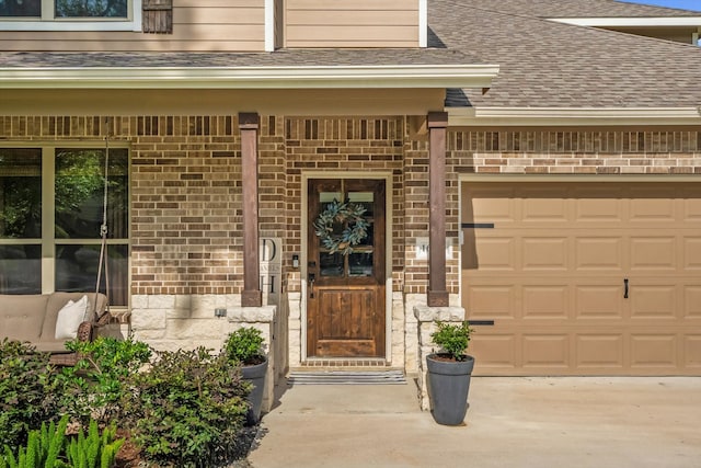 16997 White Birch Ln, Conroe, TX 77385 - entrance to property featuring roof with shingles, brick siding, concrete driveway, and an attached garage