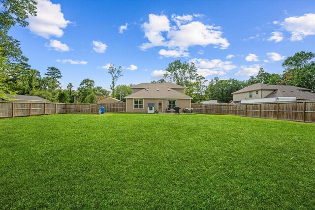 16997 White Birch Ln, Conroe, TX 77385 - view of yard featuring a patio area