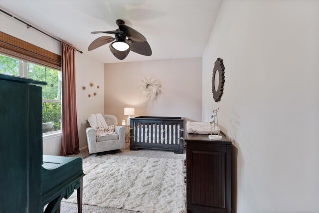 16997 White Birch Ln, Conroe, TX 77385 - bedroom with a nursery area, carpet, and a ceiling fan