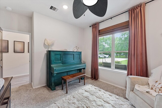 16997 White Birch Ln, Conroe, TX 77385 - living area with carpet flooring, baseboards, and a ceiling fan
