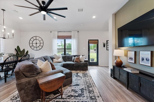 16997 White Birch Ln, Conroe, TX 77385 - living area featuring a chandelier, light wood-type flooring, a ceiling fan, recessed lighting, and baseboards