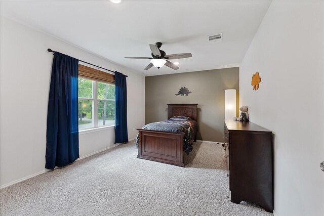 16997 White Birch Ln, Conroe, TX 77385 - bedroom featuring carpet, baseboards, and a ceiling fan