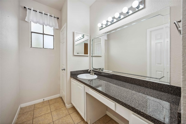 2255 Braeswood Park Dr Unit 105, Houston, TX 77030 - bathroom featuring vanity, tile patterned flooring, and baseboards