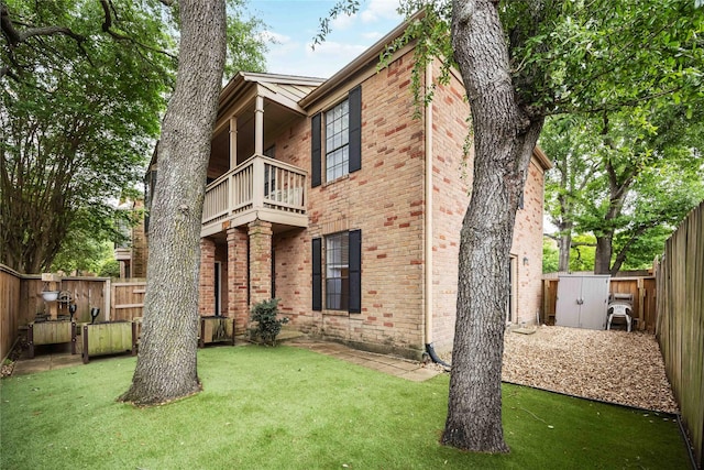 2255 Braeswood Park Dr Unit 105, Houston, TX 77030 - rear view of property featuring a balcony and brick siding