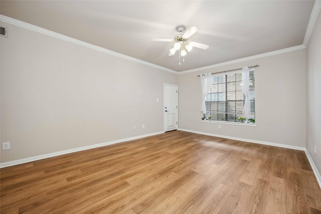 2255 Braeswood Park Dr Unit 105, Houston, TX 77030 - empty room featuring ceiling fan, crown molding, light wood-type flooring, and baseboards