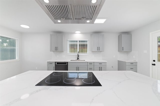 7211 Autumn Grove Dr, Houston, TX 77072 - kitchen with black electric stovetop, a sink, gray cabinetry, range hood, and recessed lighting