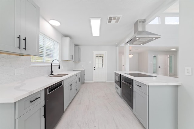 7211 Autumn Grove Dr, Houston, TX 77072 - kitchen featuring black appliances, island exhaust hood, a sink, decorative backsplash, and baseboards