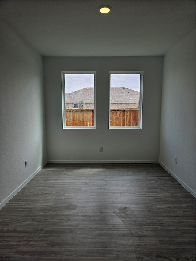 10611 Autumn Trace Dr, Beasley, TX 77417 - empty room featuring dark wood-style floors and baseboards