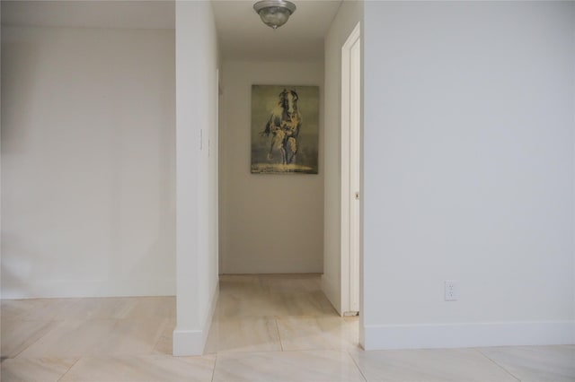 1007 Prune St, La Marque, TX 77568 - corridor featuring light tile patterned flooring and baseboards