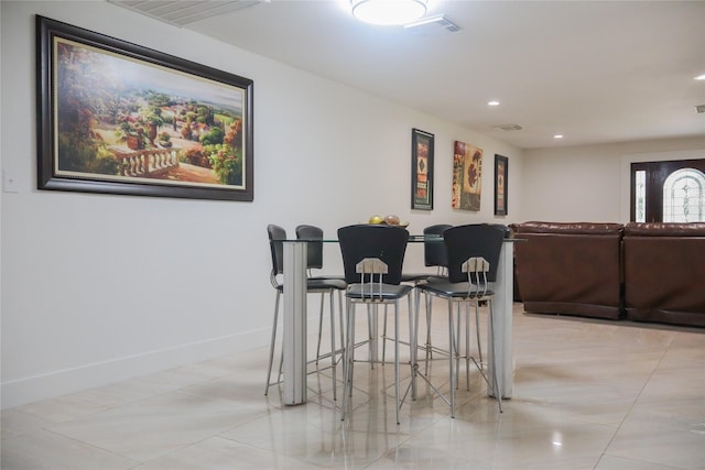 1007 Prune St, La Marque, TX 77568 - bar with baseboards and recessed lighting